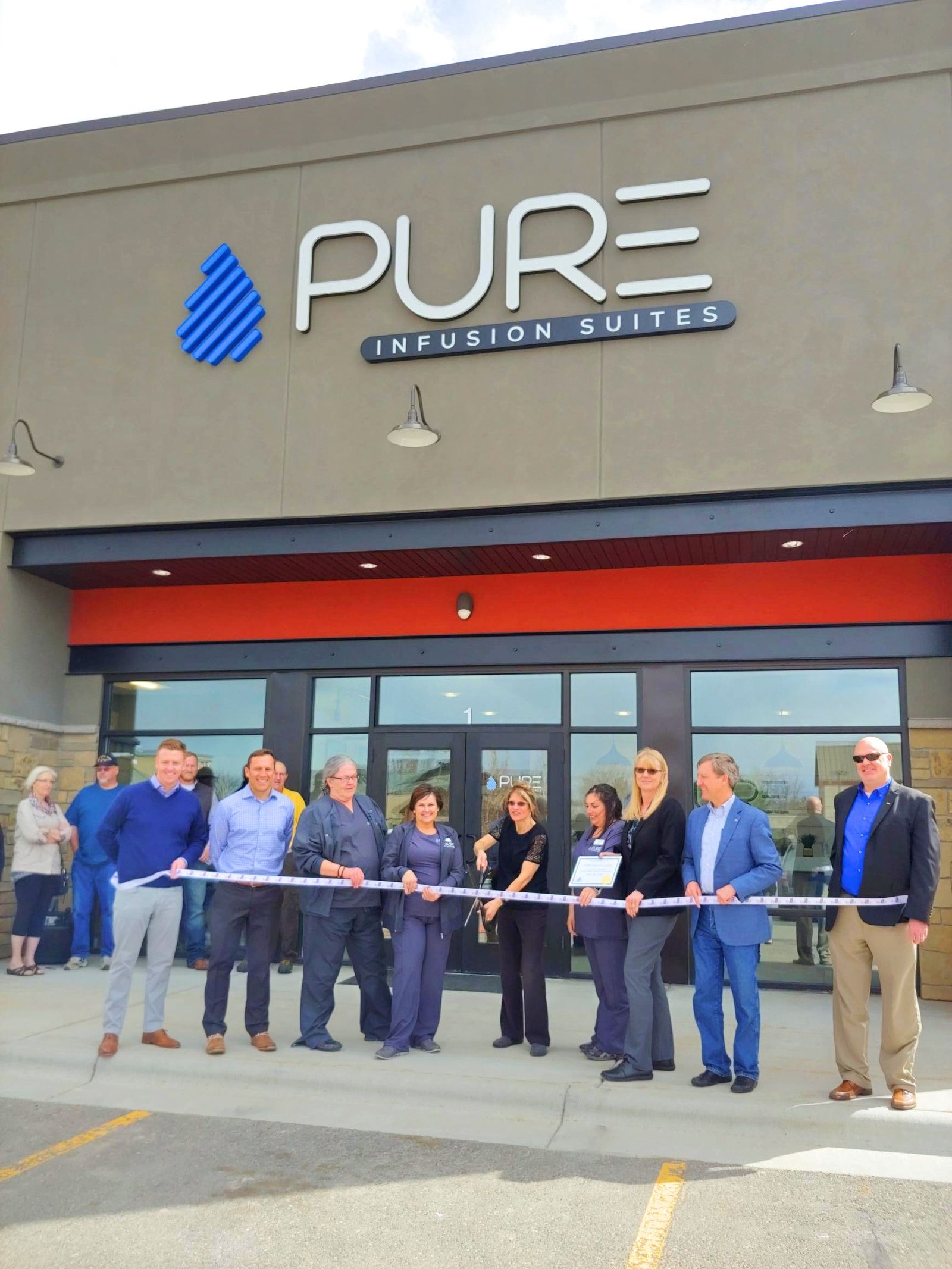 Ribbon cutting at the opening of Pure Infusion Suites, April 2019